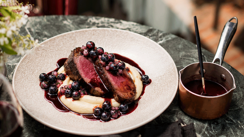 Springbok Fillet with silky parsnip purée, rich cassis jus and a fresh blueberry salsa